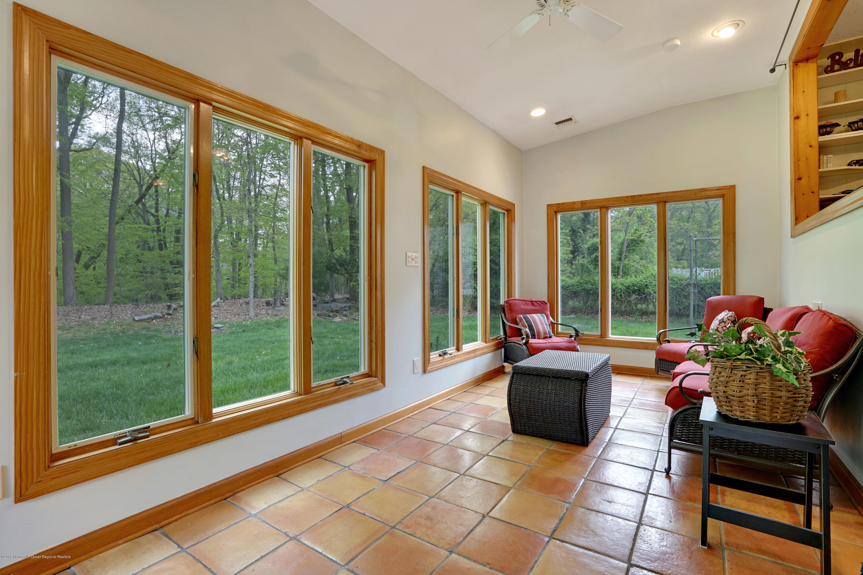 26 Marc Drive Matawan, NJ 07747 - Photo 16 of 30 a living room with furniture and floor to ceiling windows