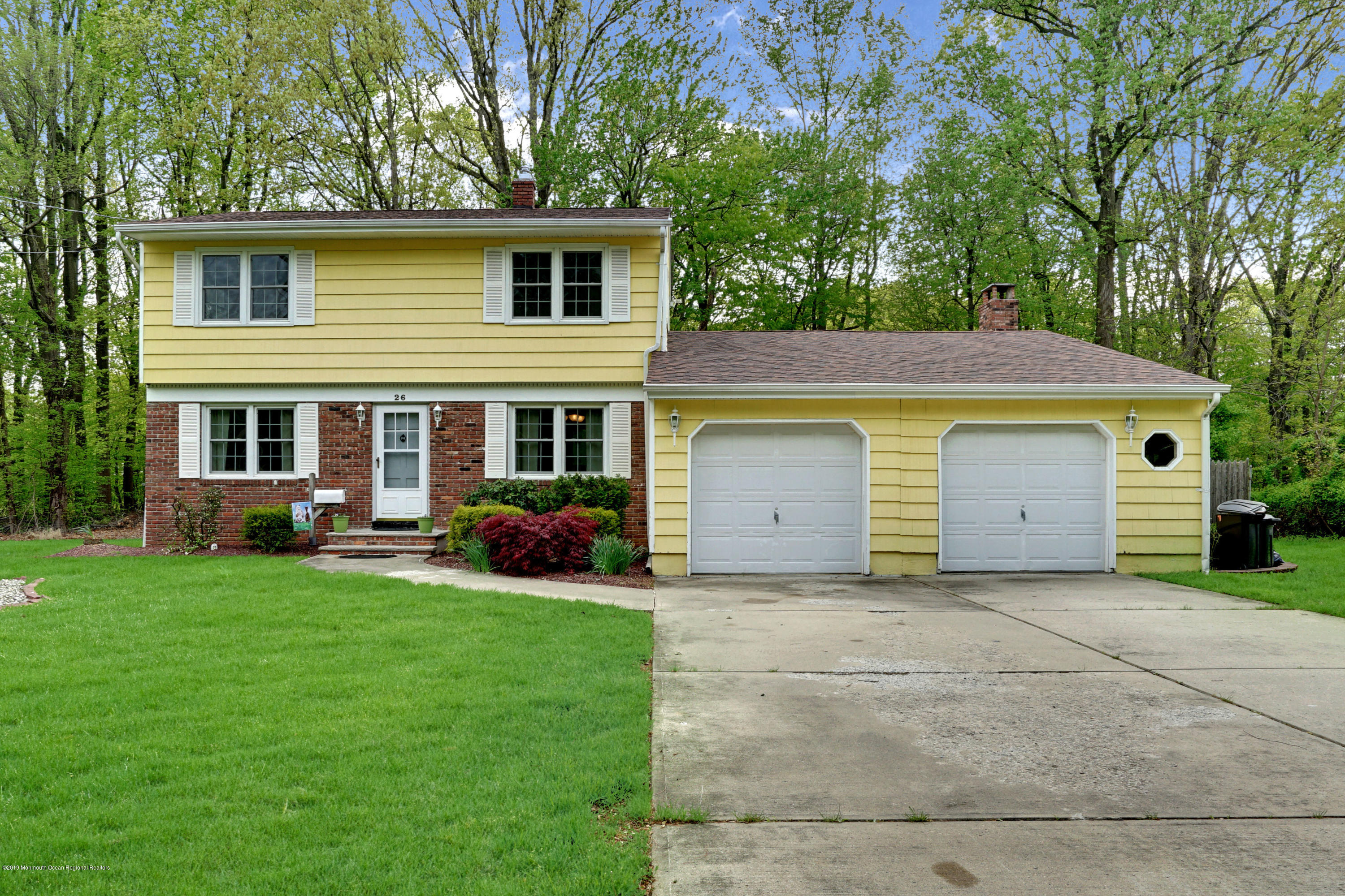 26 Marc Drive Matawan, NJ 07747 - Photo 2 of 30 a view of a house with a yard and large tree