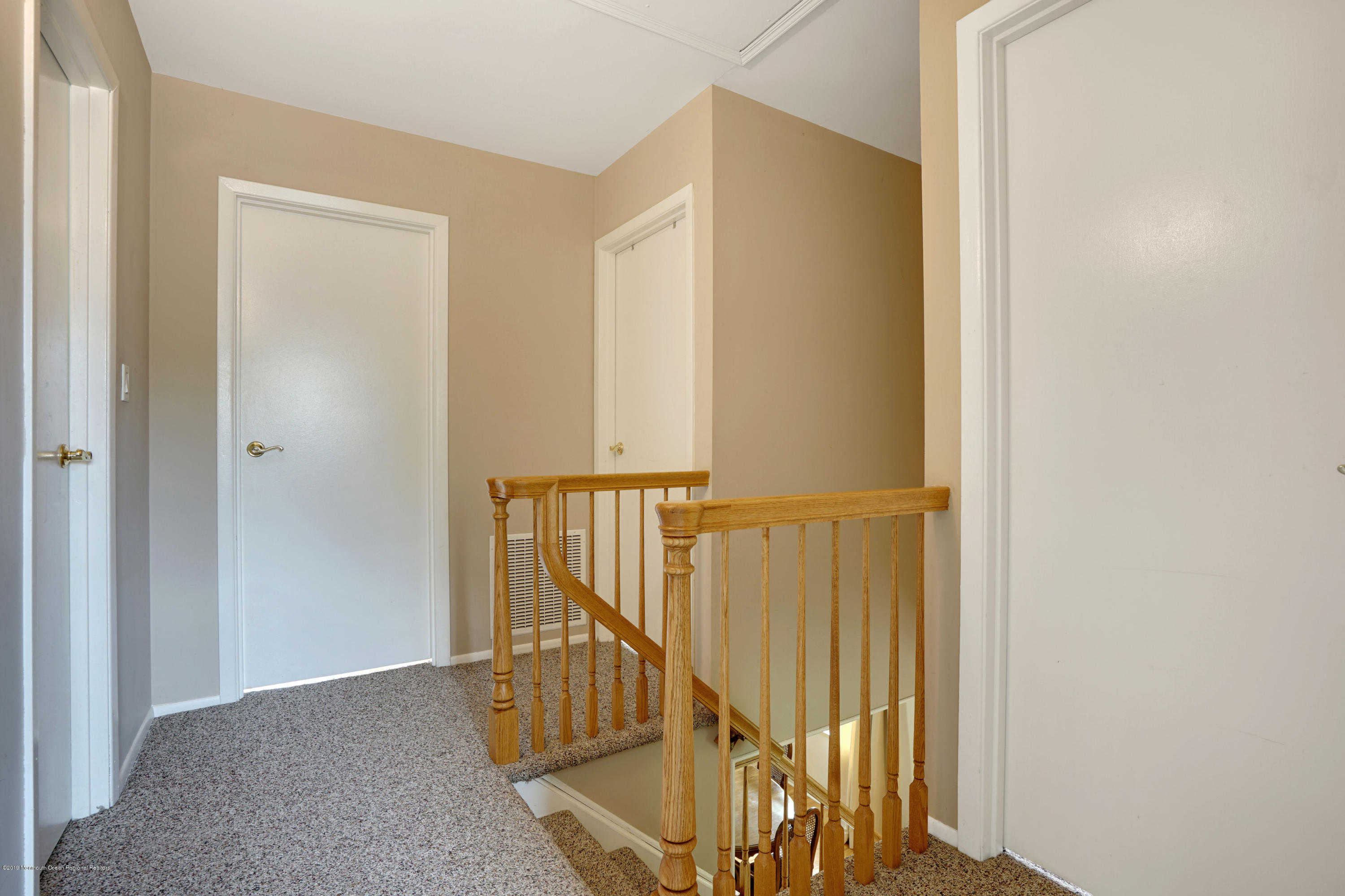 26 Marc Drive Matawan, NJ 07747 - Photo 24 of 30 a view of a hallway with the wooden floor