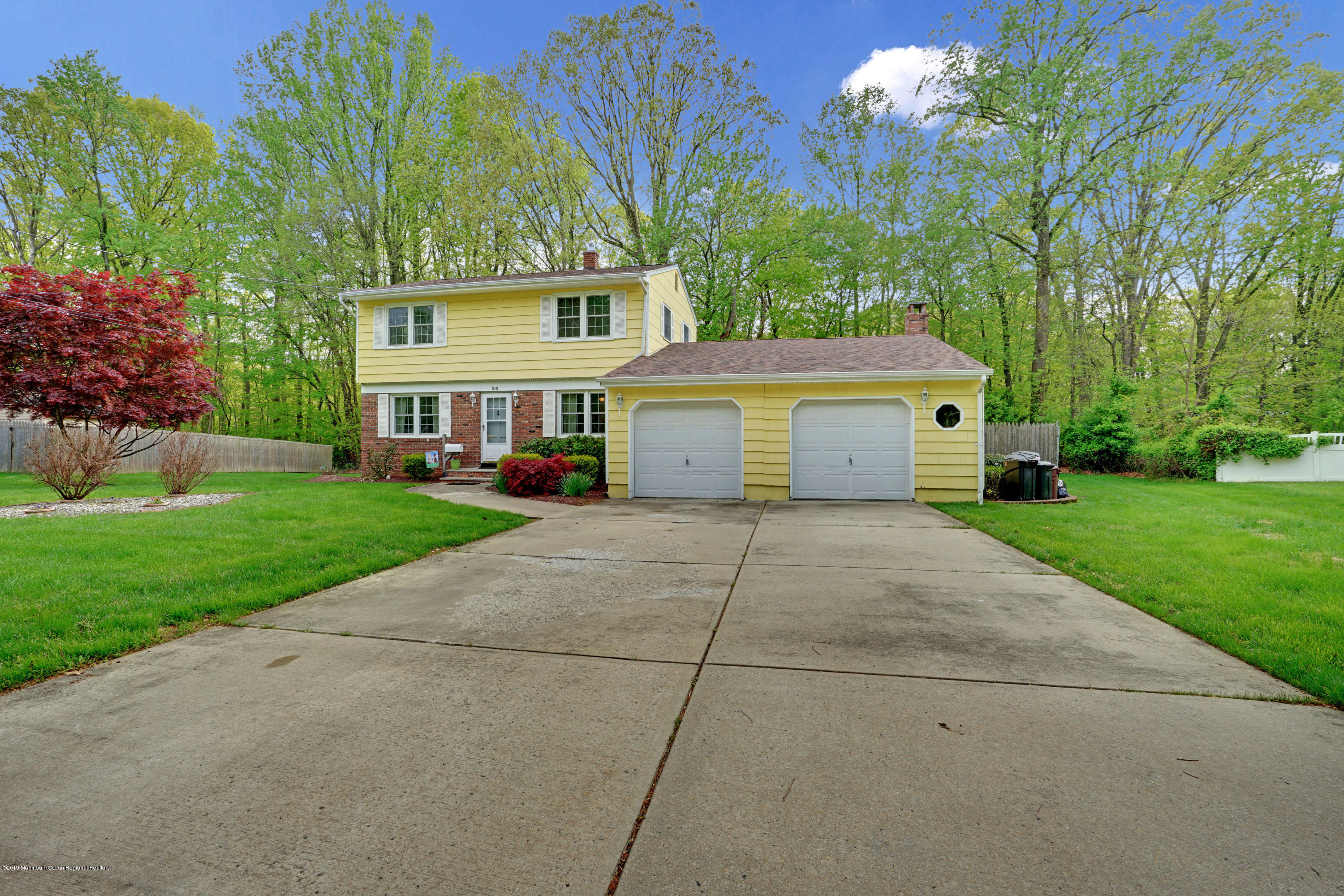 26 Marc Drive Matawan, NJ 07747 - Photo 25 of 30 a front view of a house with a yard and garage
