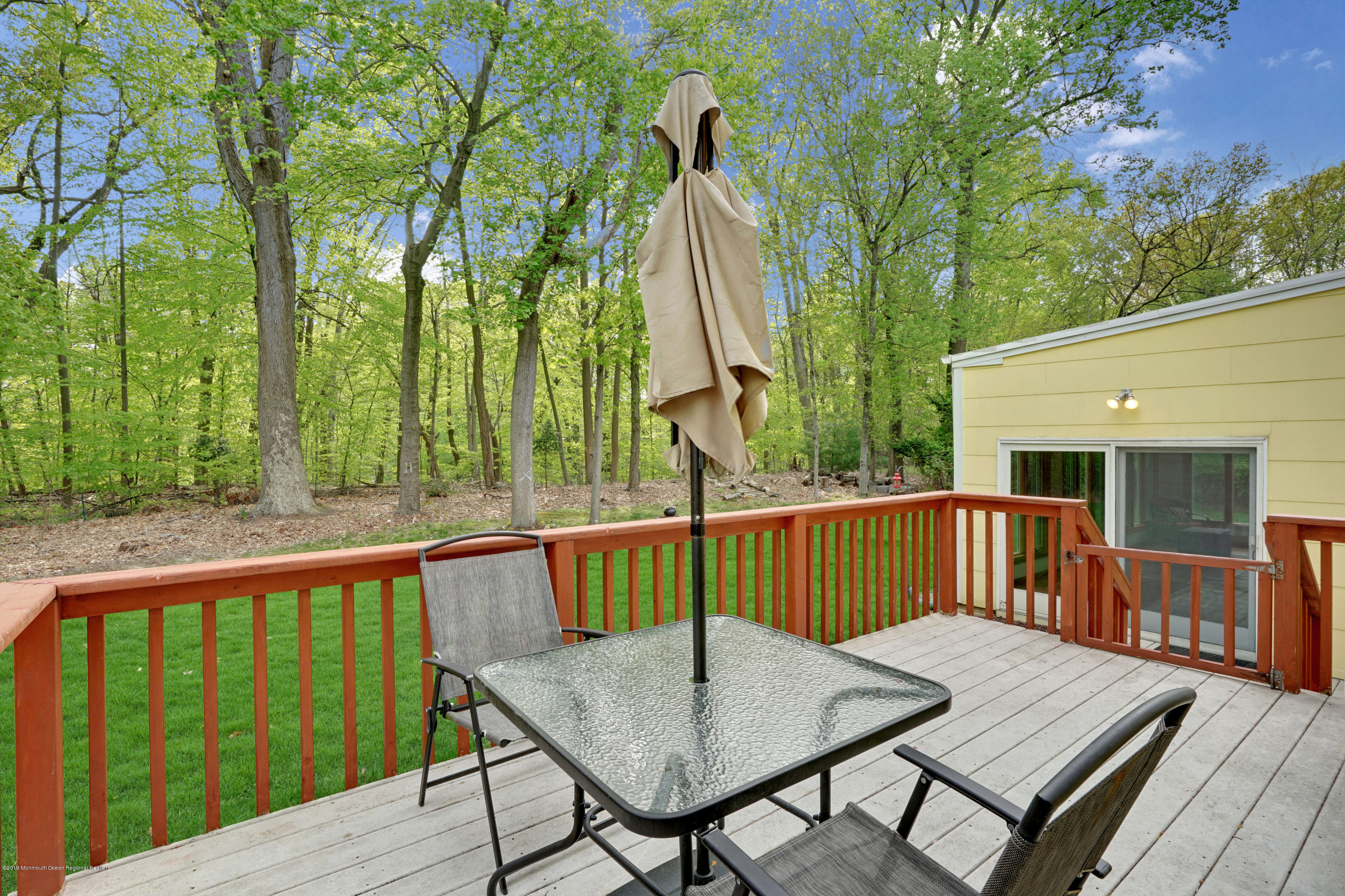 26 Marc Drive Matawan, NJ 07747 - Photo 27 of 30 a view of a wooden deck with furniture