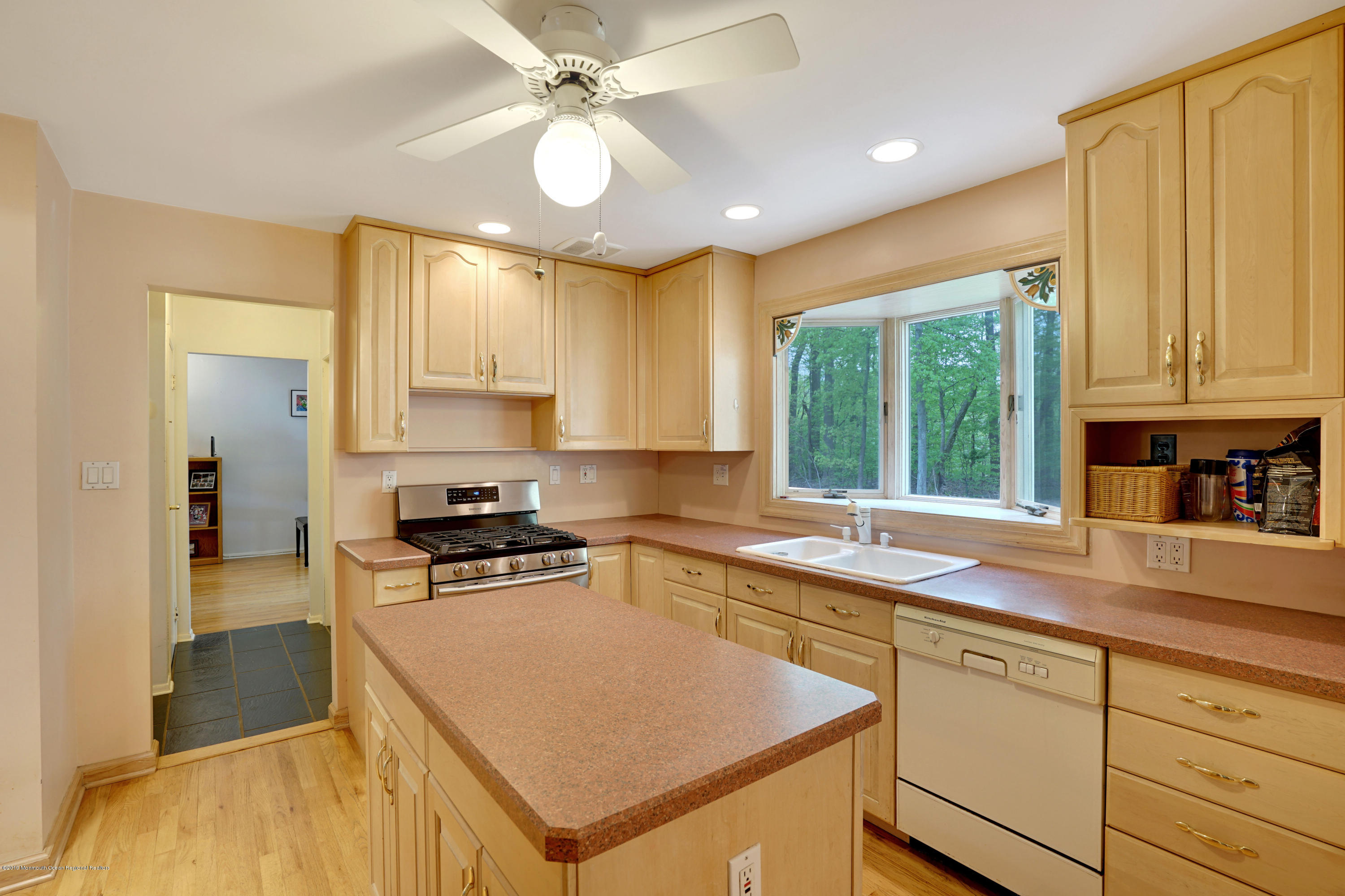 26 Marc Drive Matawan, NJ 07747 - Photo 9 of 30 a kitchen with a stove a sink and a refrigerator