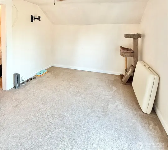 a bedroom with a bed and a lamp