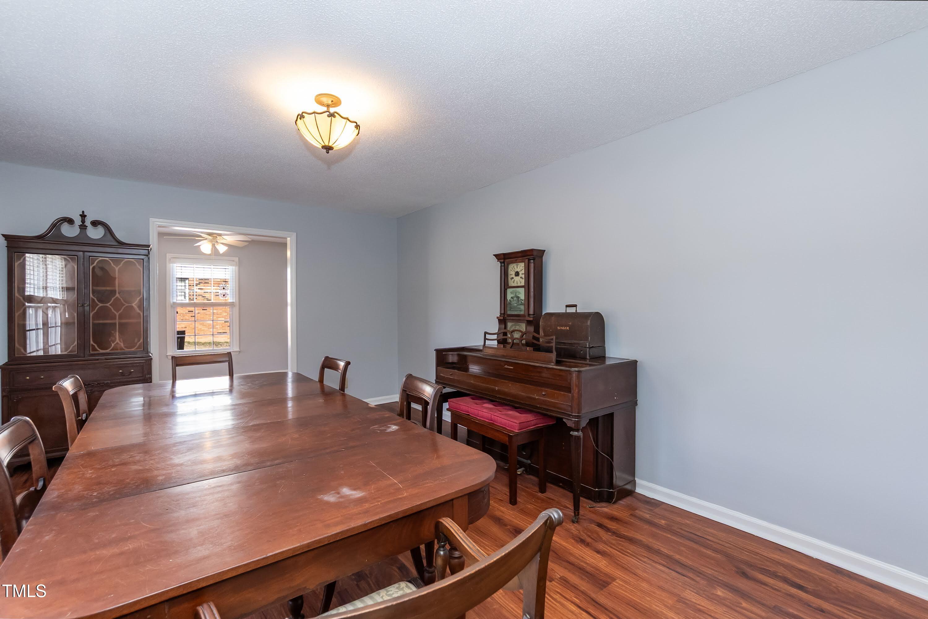 5604 Genesee Drive Durham, NC 27712 - Photo 21 of 45 a view of a dining room with furniture and wooden floor