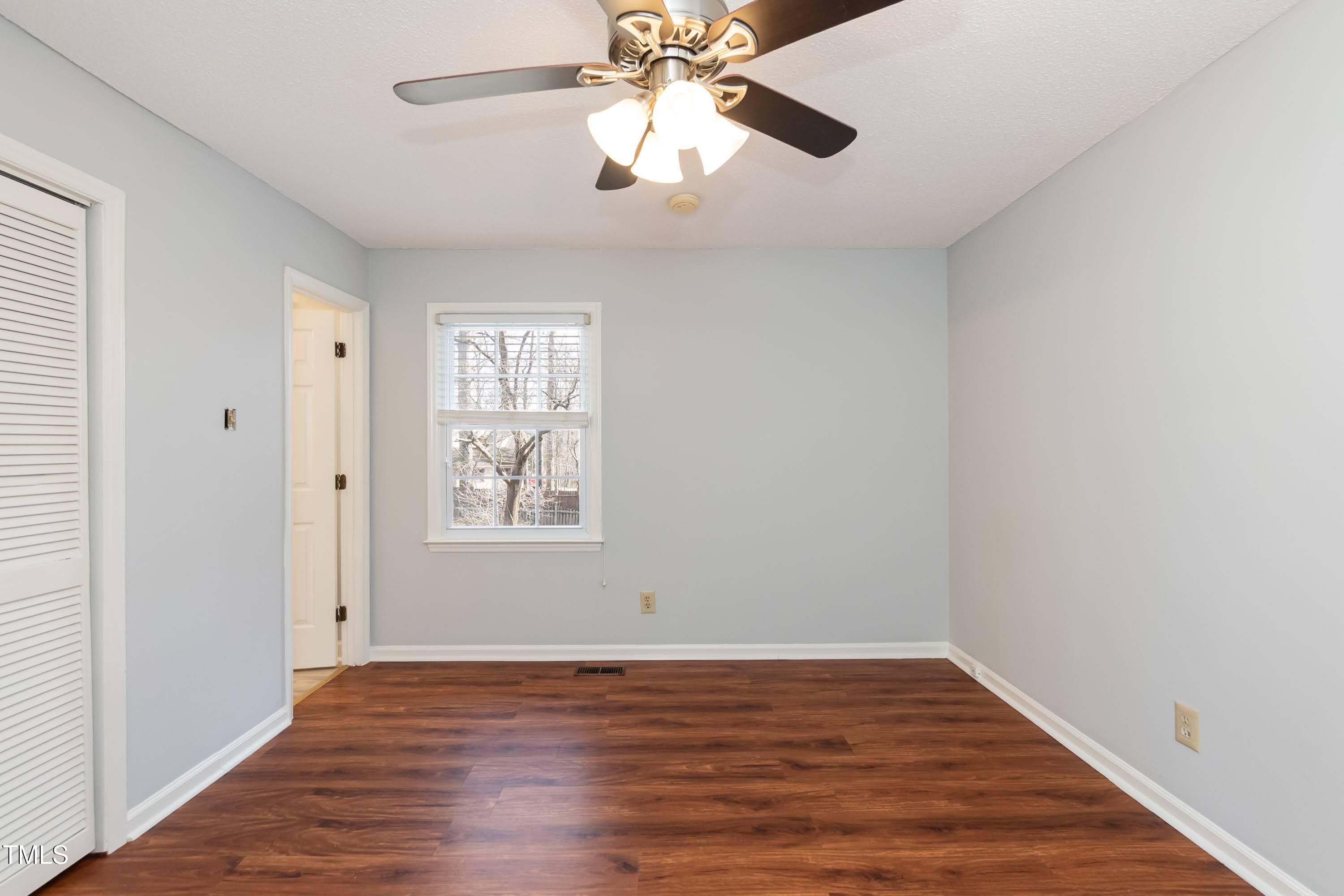 5604 Genesee Drive Durham, NC 27712 - Photo 24 of 45 a view of an empty room with wooden floor and a window