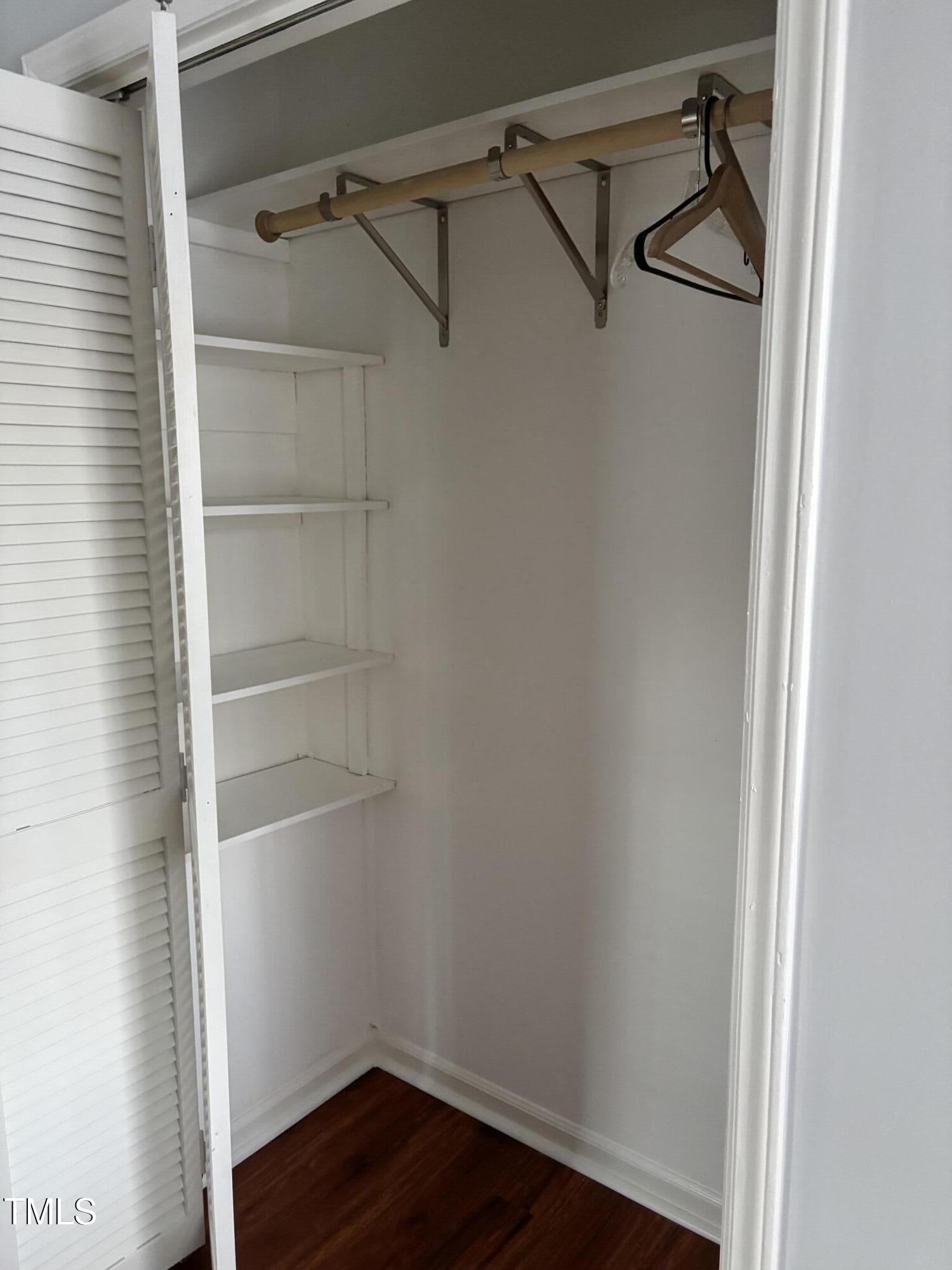 5604 Genesee Drive Durham, NC 27712 - Photo 30 of 45 a view of walk in closet with empty racks