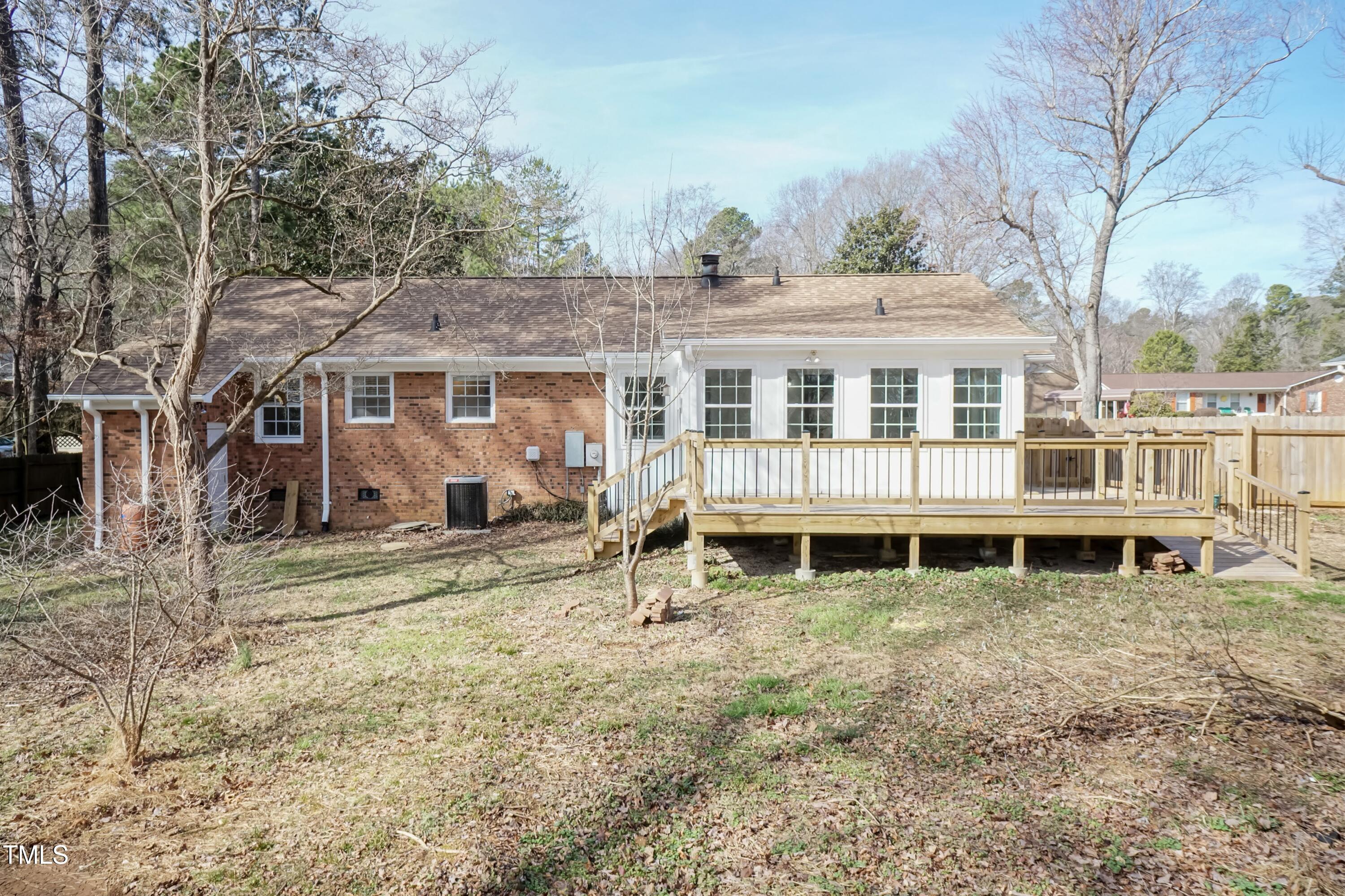 5604 Genesee Drive Durham, NC 27712 - Photo 39 of 45 a view of a house with a yard and wooden fence