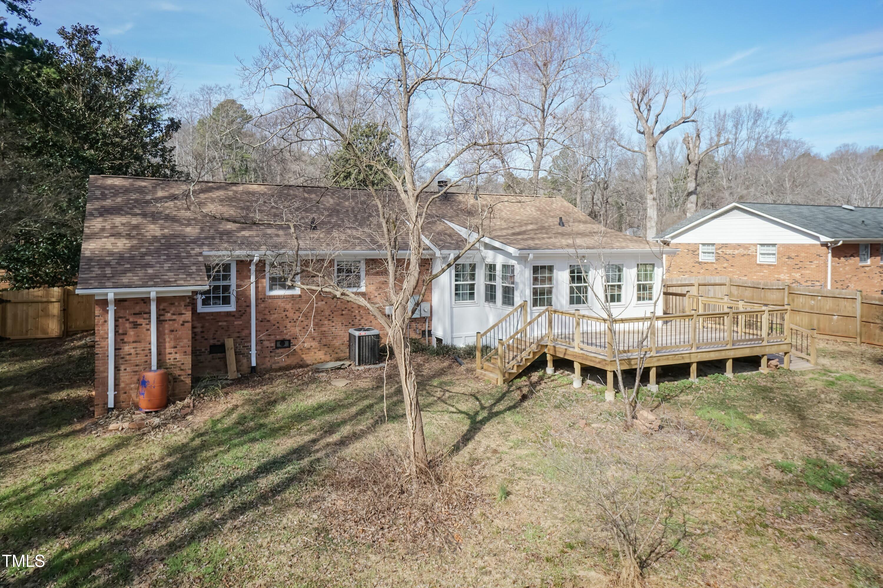5604 Genesee Drive Durham, NC 27712 - Photo 41 of 45 an aerial view of a house with a yard and balcony