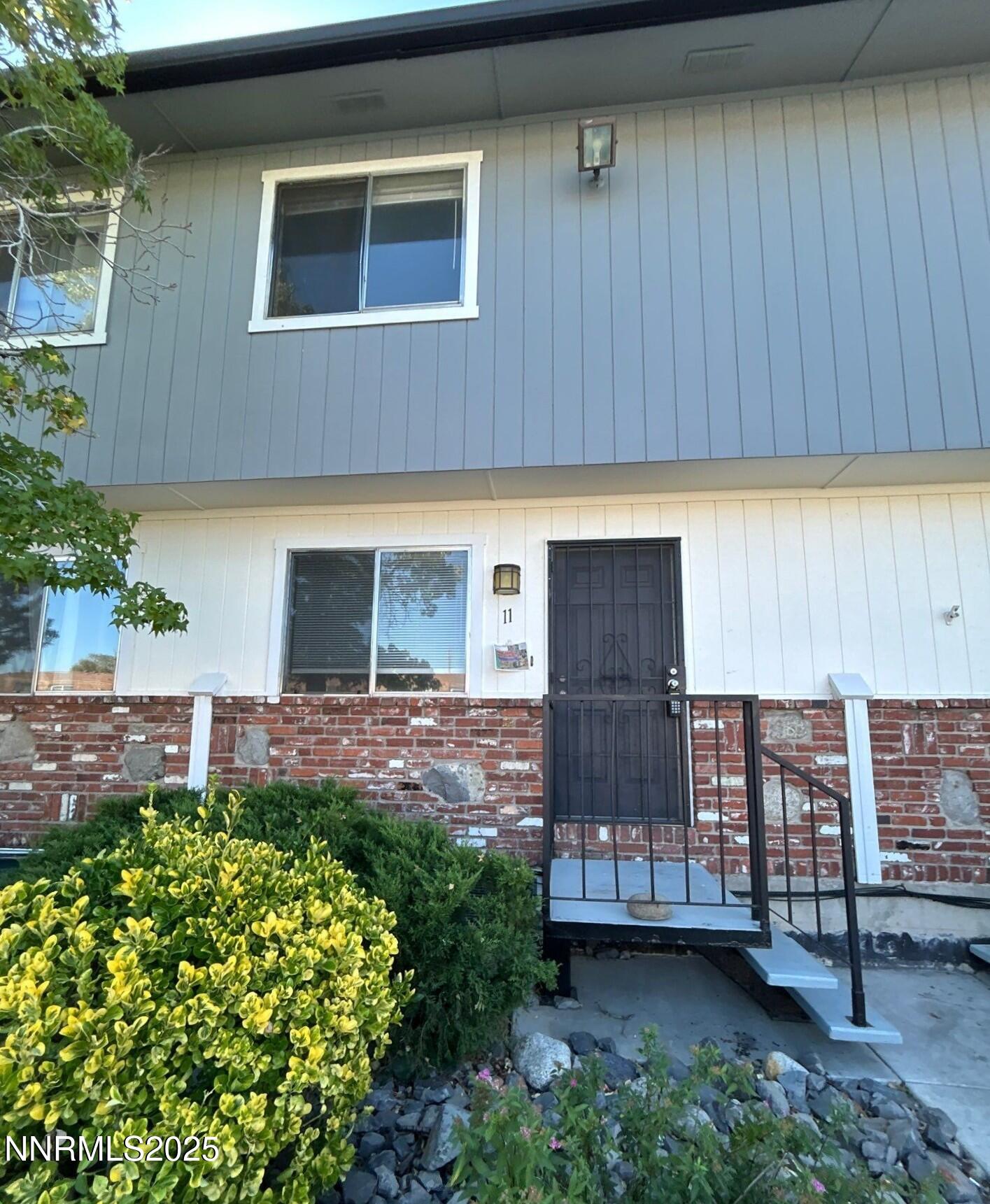 1410 East 9th Street, Unit 11 Reno, NV 89512 - Photo 1 of 5 a front view of a house with garden
