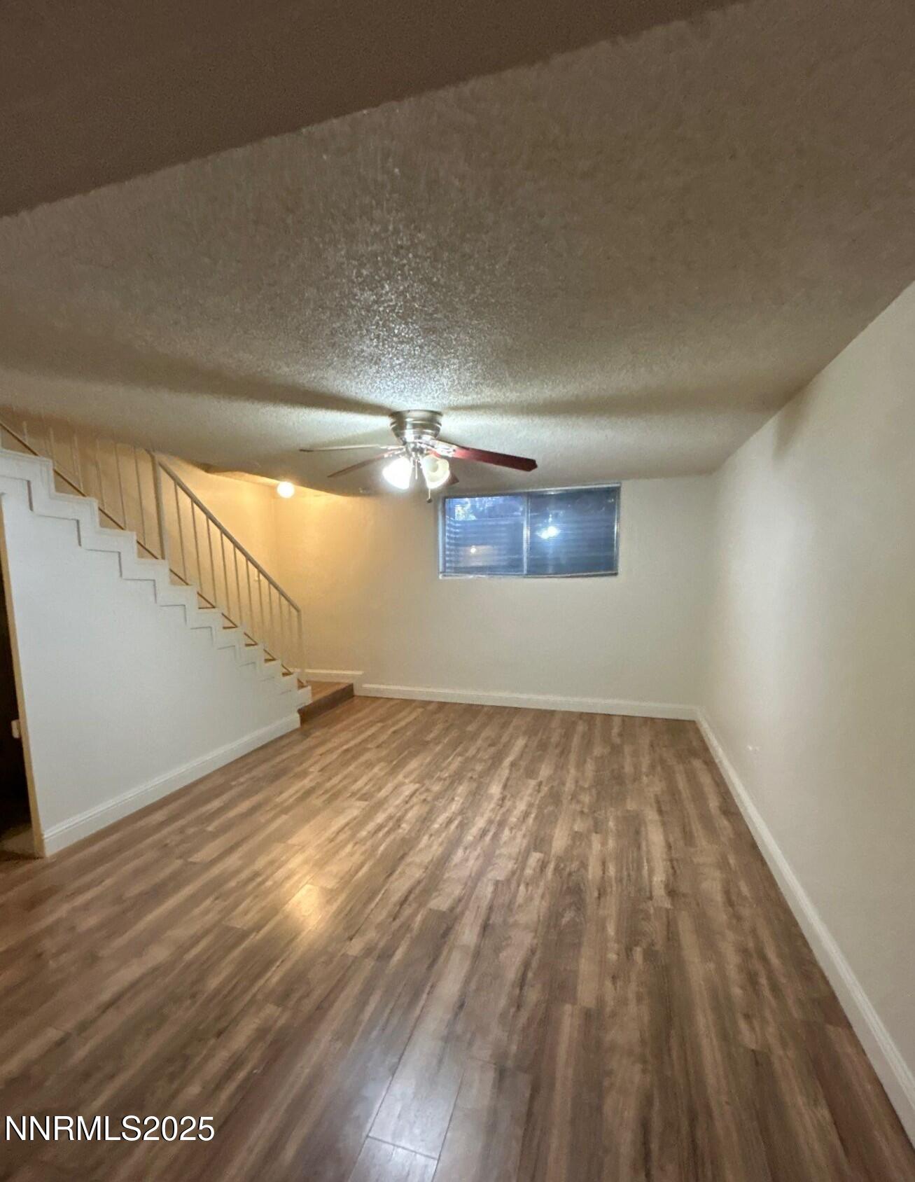 1410 East 9th Street, Unit 11 Reno, NV 89512 - Photo 2 of 5 a view of empty room with wooden floor