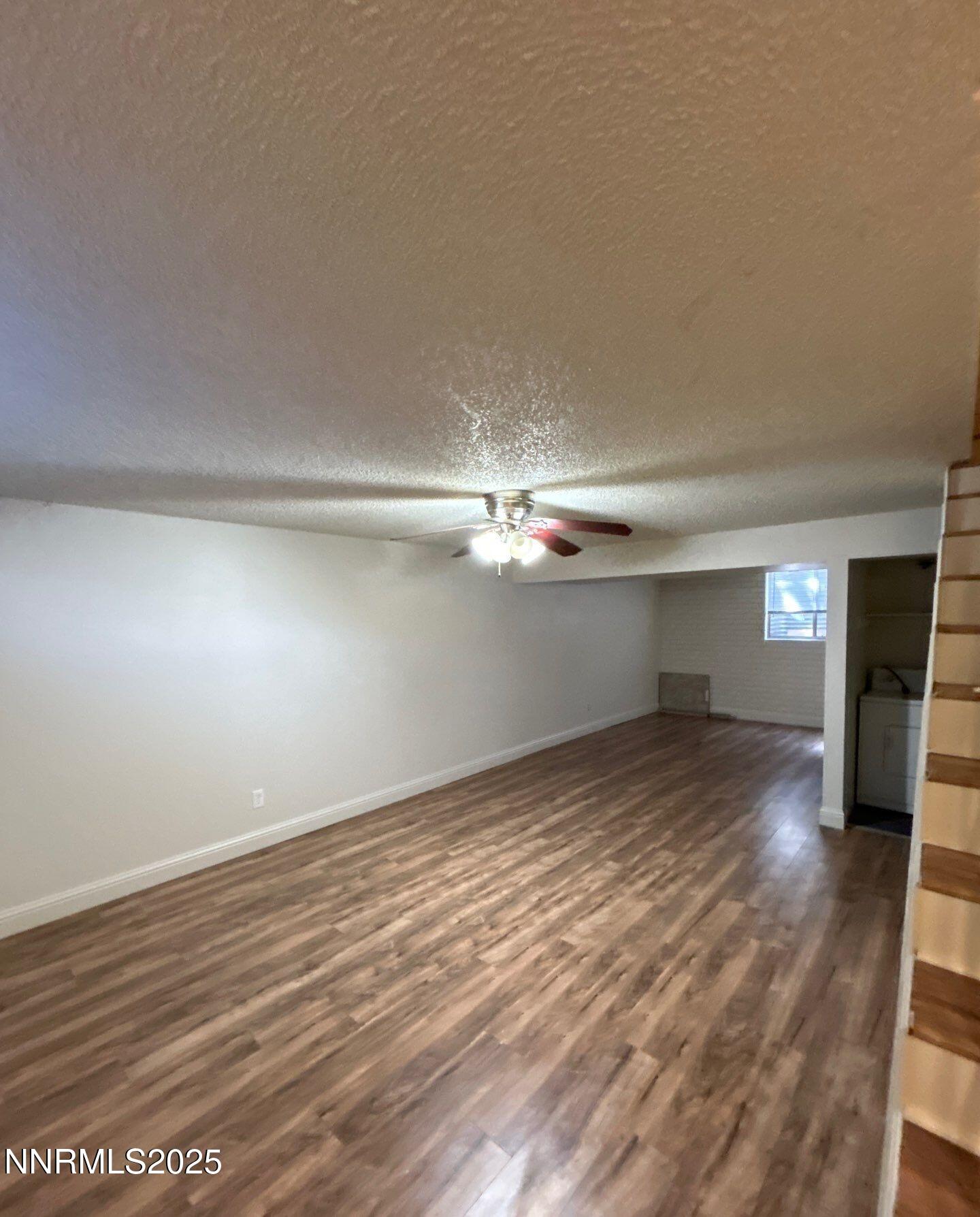 1410 East 9th Street, Unit 11 Reno, NV 89512 - Photo 3 of 5 wooden floor in an empty room