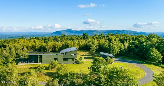 a view of a house with a big yard