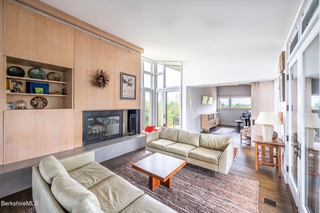a hallway with a couch and a rug