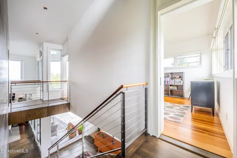 a bedroom with a bed and glass window
