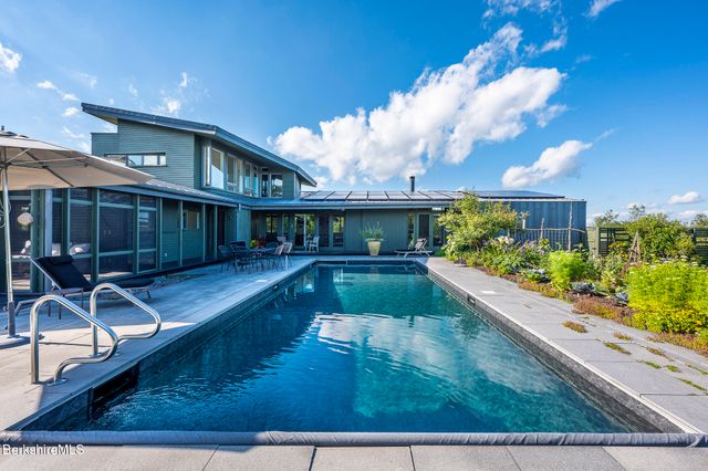 a bedroom with furniture and a fireplace