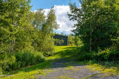 a view of a house with a tree