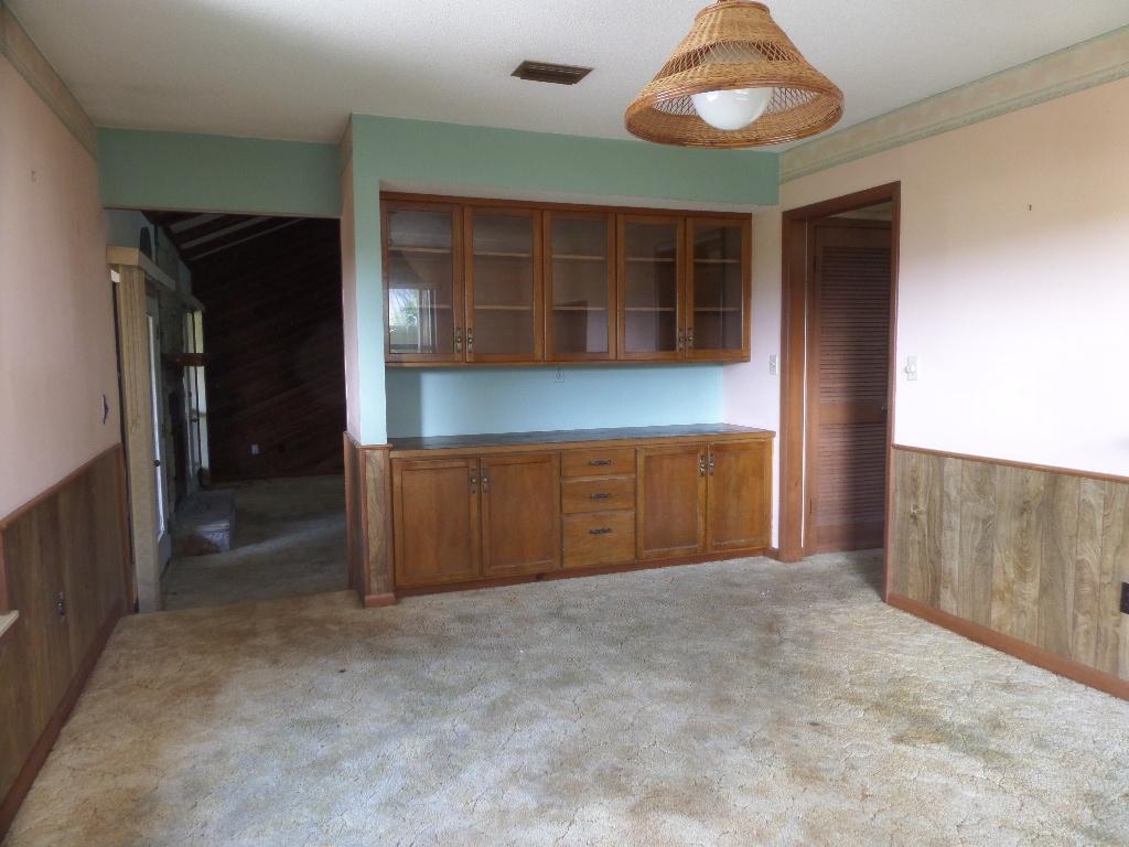 1456 Bay Grove Road Freeport, FL 32439 - Photo 5 of 9 a view of an empty room with a cabinet