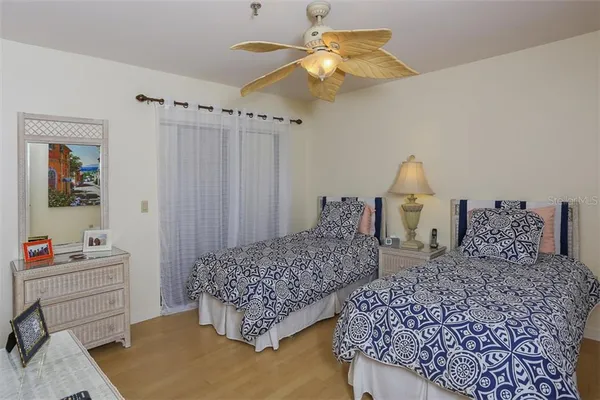 a bathroom with a sink a toilet a mirror and shower