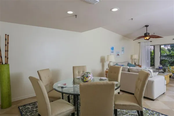 a dining room with furniture and window