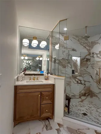 a room with a sink and chandelier