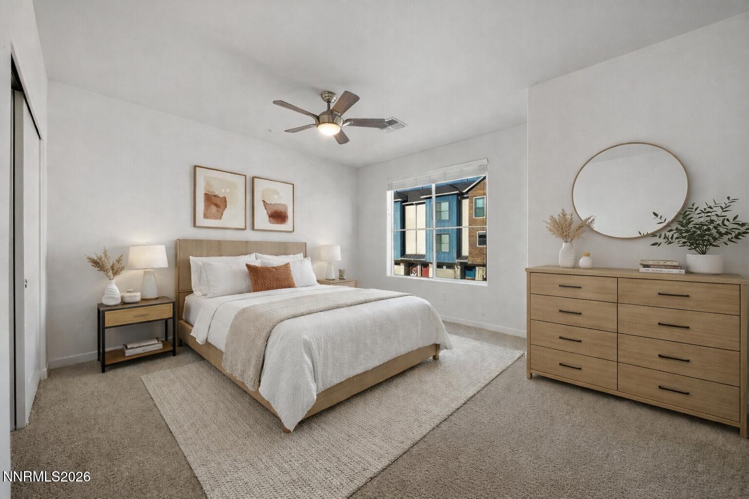 530 Gloria May Lane Reno, NV 89503 - Photo 14 of 34 a spacious bedroom with a large bed and a dresser