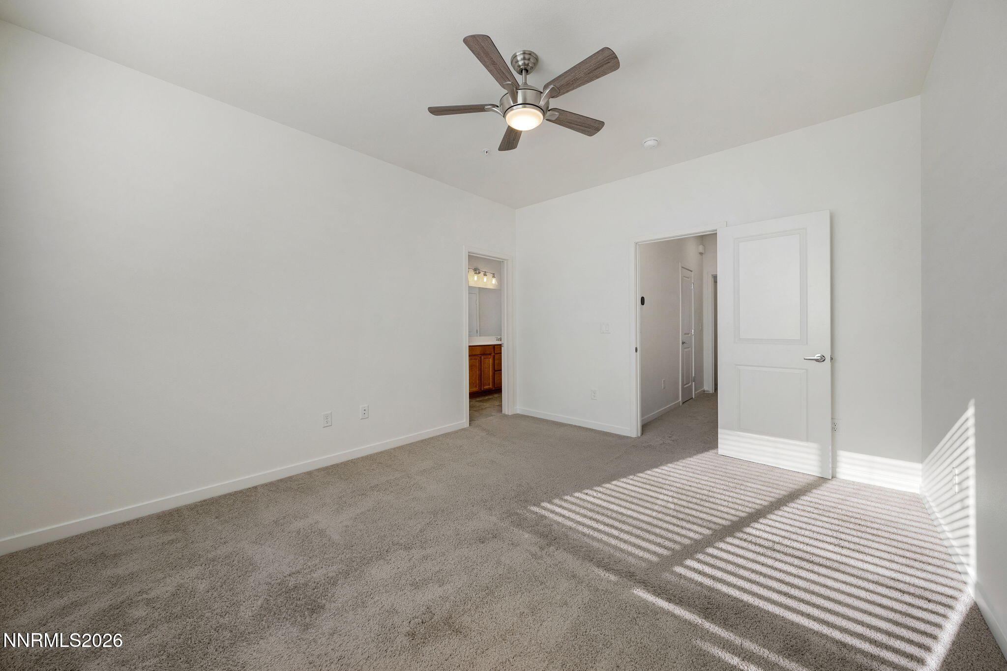 530 Gloria May Lane Reno, NV 89503 - Photo 20 of 34 a view of a livingroom with a chandelier fan and wooden floor