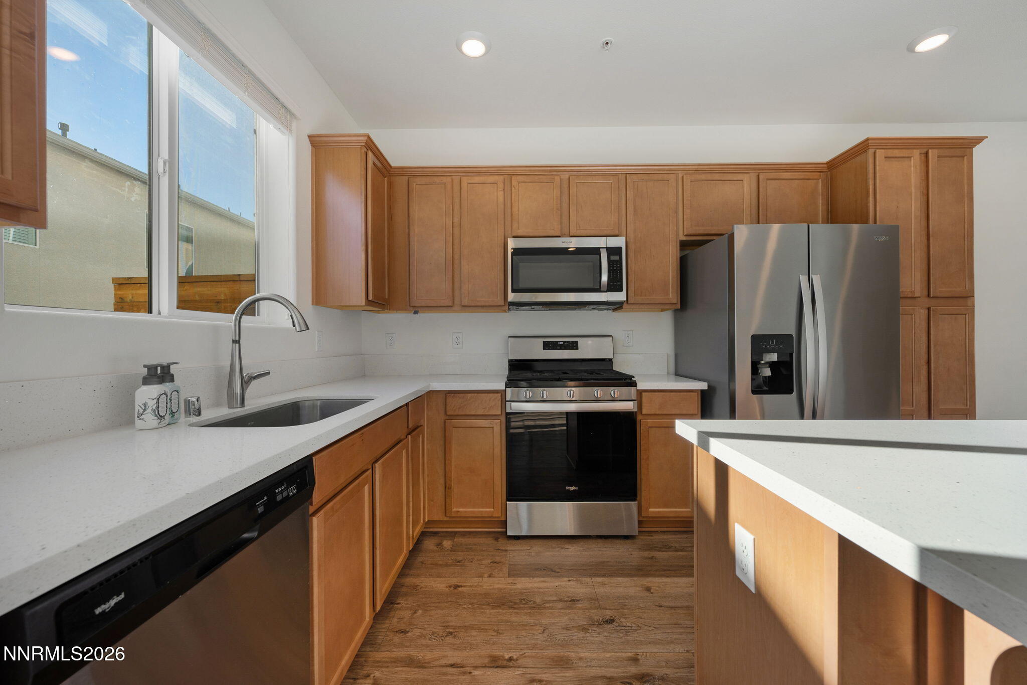 530 Gloria May Lane Reno, NV 89503 - Photo 8 of 34 a kitchen with stainless steel appliances a refrigerator sink and microwave