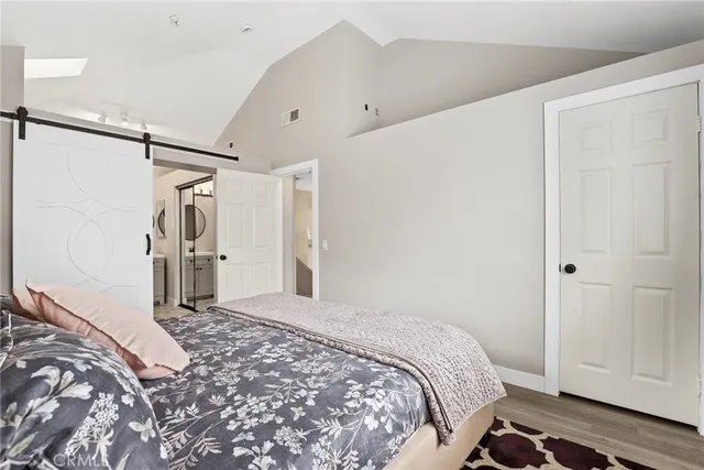 a bathroom with a toilet a sink and a large mirror