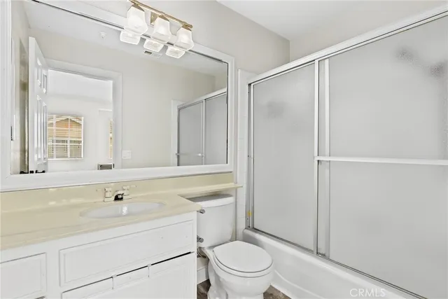 a view of a bathroom with sink and mirror
