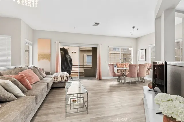 a living room with furniture window and a flat screen tv