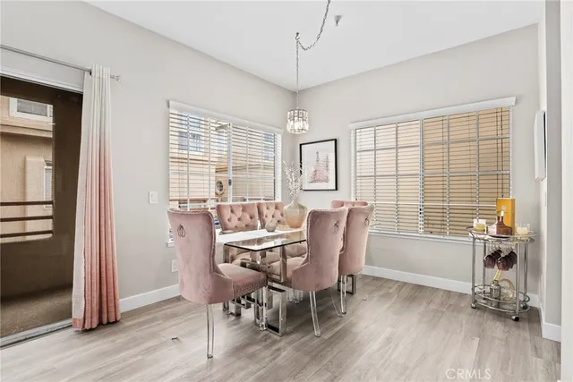 a dining room with furniture window wooden floor