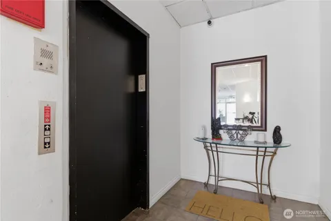 a view of a room that has a table and chairs in it