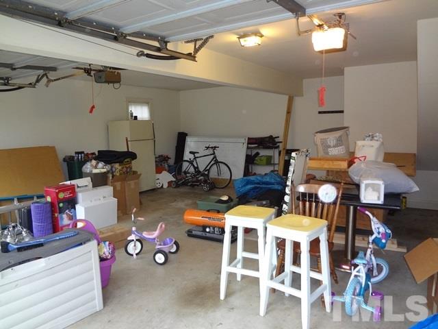 1400 October Road Raleigh, NC 27614 - Photo 24 of 25 a room with lots of furniture and clutter