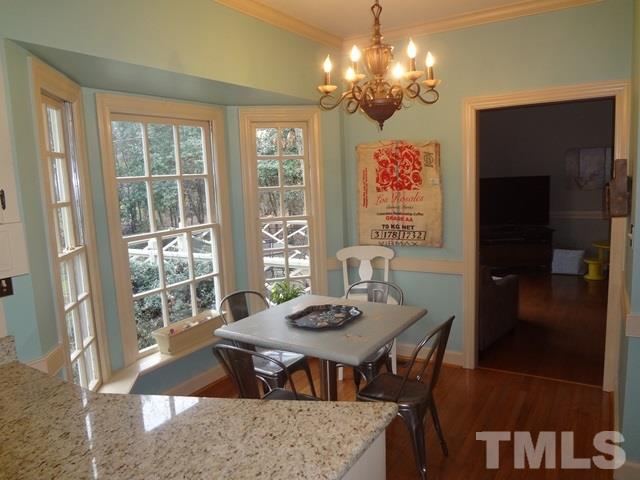 1400 October Road Raleigh, NC 27614 - Photo 8 of 25 a view of a dining room with furniture window and outside view