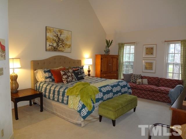 1400 October Road Raleigh, NC 27614 - Photo 10 of 25 a spacious bedroom with a bed and window
