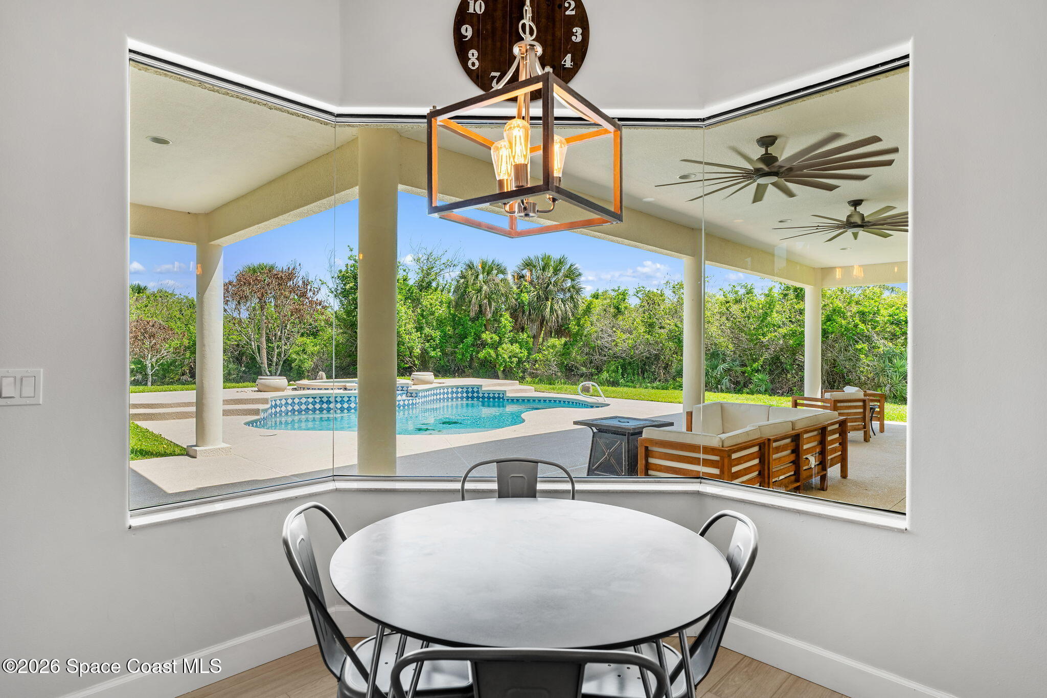 4010 Turkey Point Drive Melbourne, FL 32934 - Photo 11 of 53 a view of a dining room with furniture window and outside view
