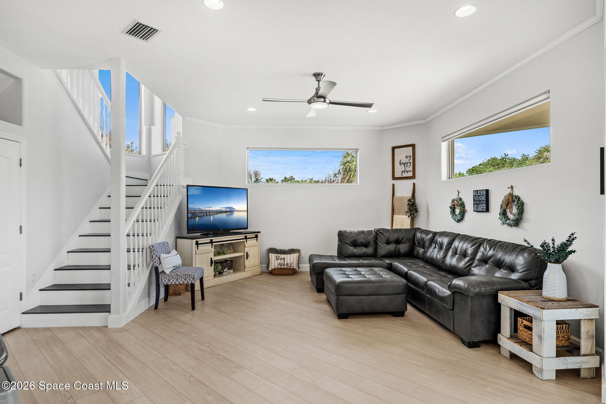 4010 Turkey Point Drive Melbourne, FL 32934 - Photo 13 of 53 a living room with furniture and a flat screen tv