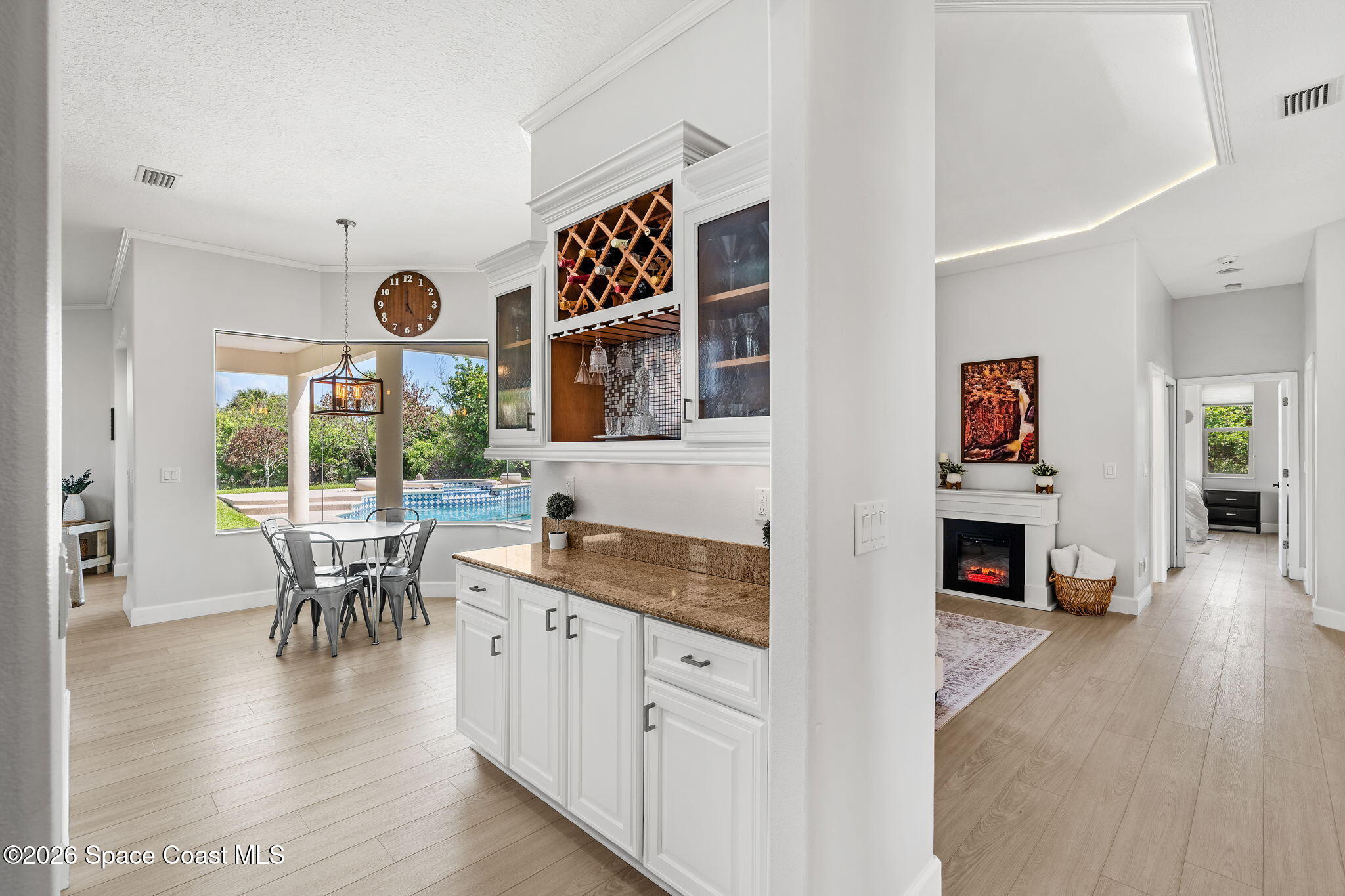 4010 Turkey Point Drive Melbourne, FL 32934 - Photo 14 of 53 an open kitchen with furniture and wooden floor
