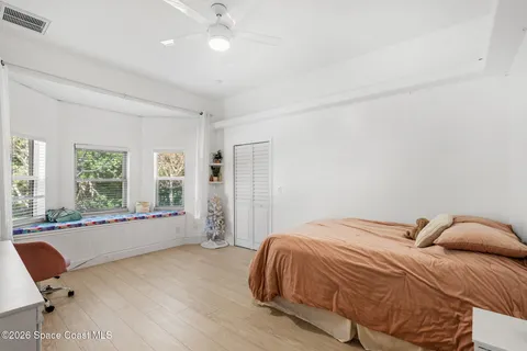 a white bath tub sitting next to a window