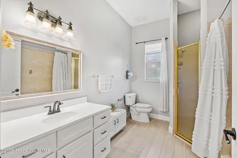a bedroom with a bed a desk and chair