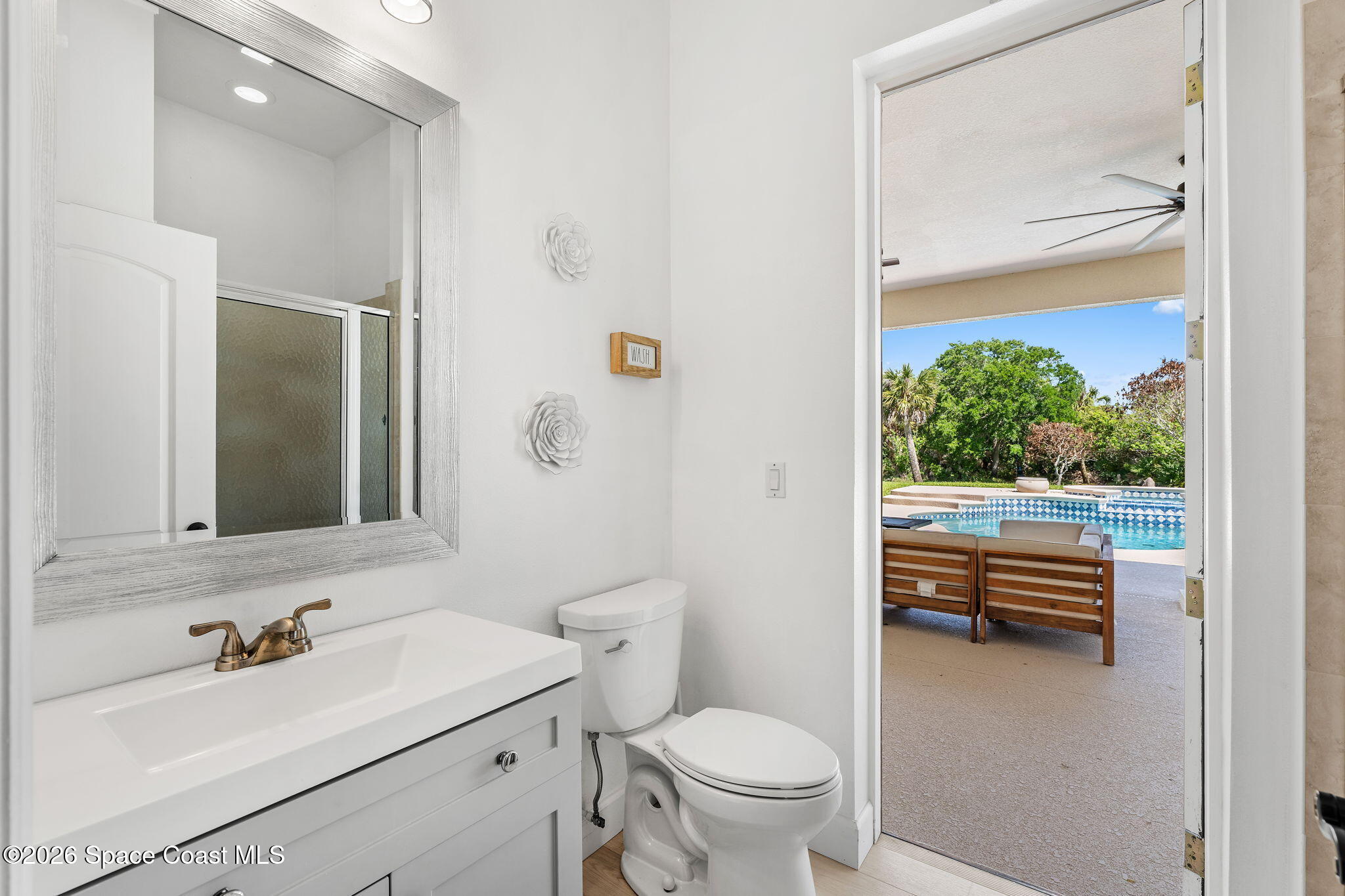 4010 Turkey Point Drive Melbourne, FL 32934 - Photo 34 of 53 a bathroom with a sink toilet and shower