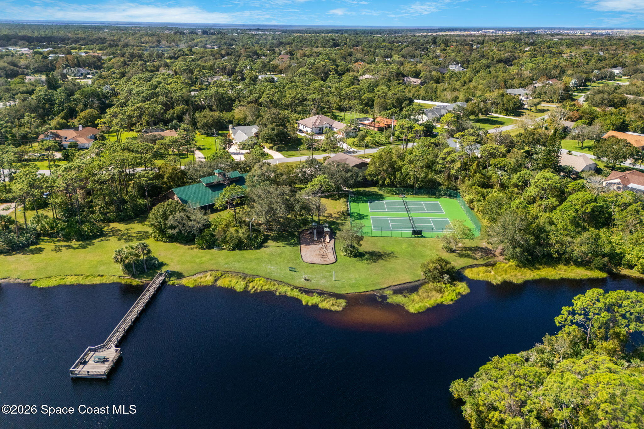 4010 Turkey Point Drive Melbourne, FL 32934 - Photo 50 of 53 a view of a golf course with parking space