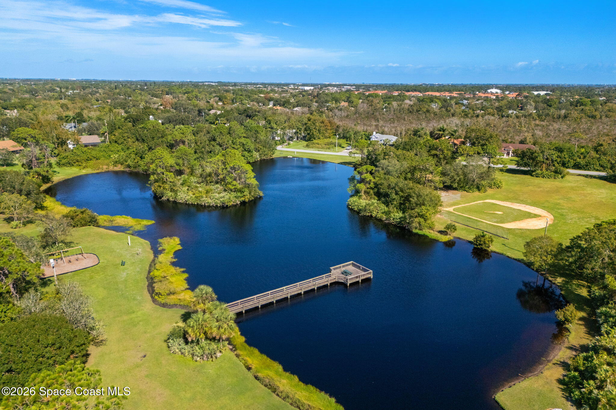 4010 Turkey Point Drive Melbourne, FL 32934 - Photo 51 of 53 an aerial view of residential houses with outdoor space