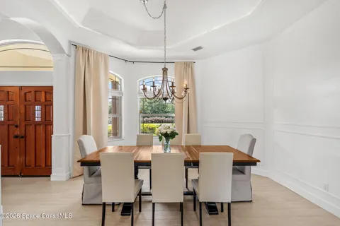 a view of a dining room with furniture window and outside view