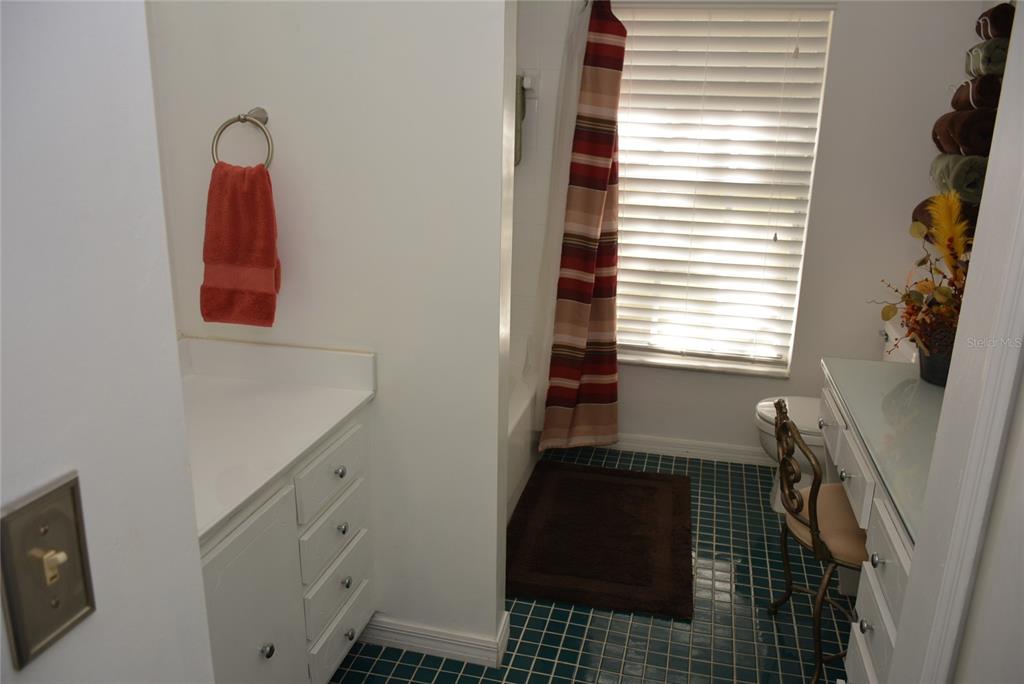 308 Tangerine Street Altamonte Springs, FL 32701 - Photo 38 of 58 Spacious guest bath has a vanity with sink on the left, dressing table with mirror on right and a tub/shower combo.