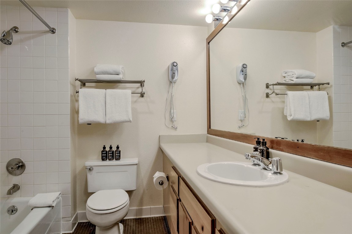 22340 Highway 6, Unit 1815 Keystone, CO 80435 - Photo 14 of 19 a bathroom with a sink toilet and vanity