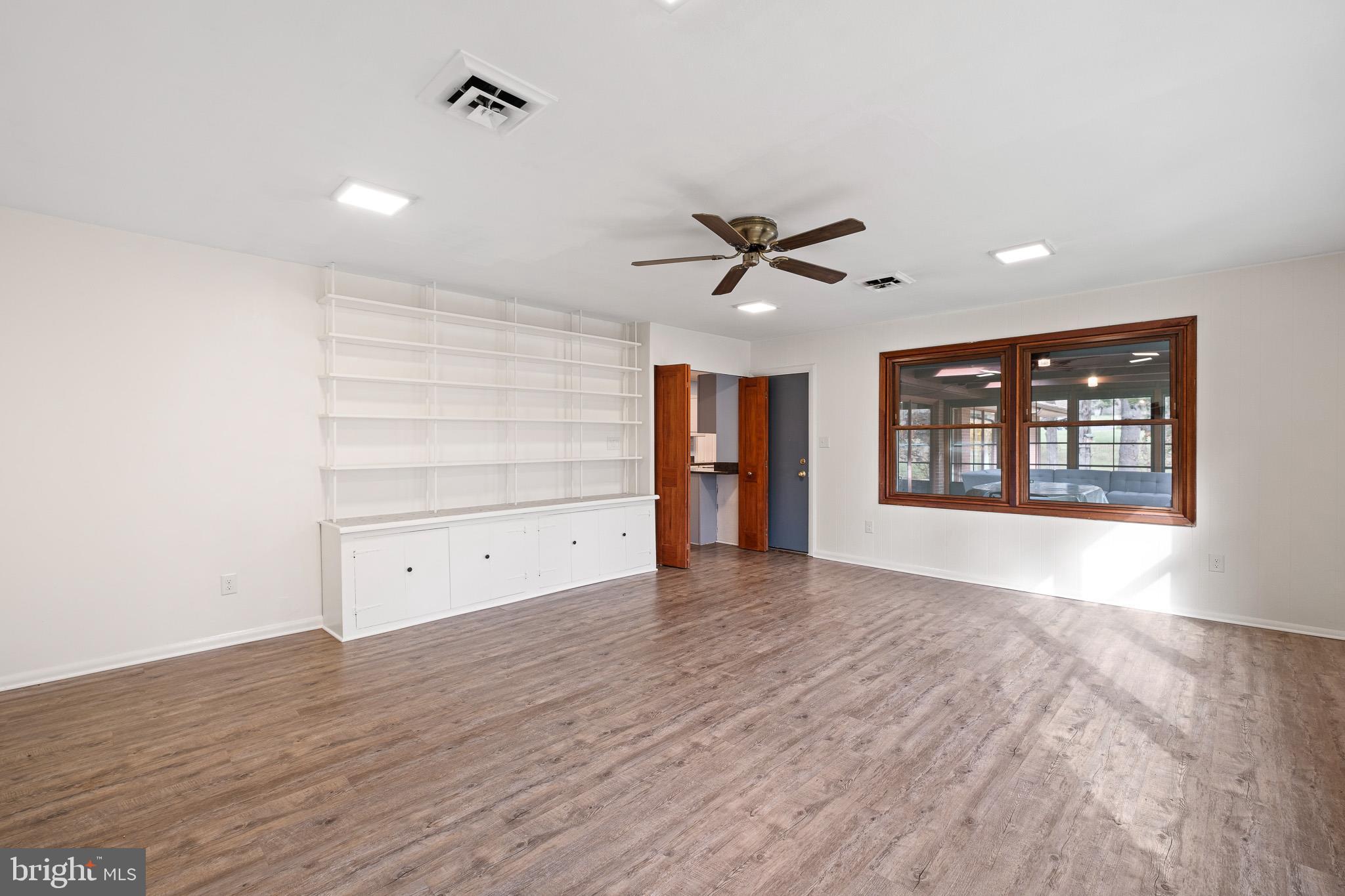 123 Unami Trail Newark, DE 19711 - Photo 11 of 31 wooden floor in an empty room with a window