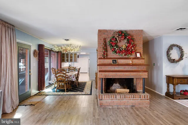 a view of a livingroom with furniture and a fireplace