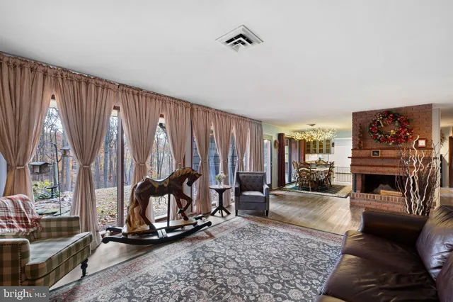 a view of a livingroom with furniture and a fireplace