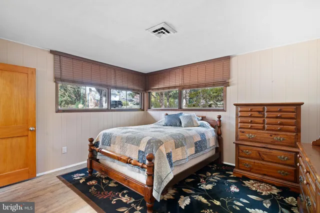 a bed room with a bed and a window